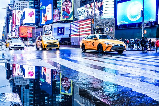 Yellow Taxi on Times Square, New York City. Photographed on rainy day on December 18, 2021
