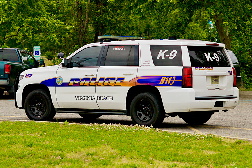 Virginia Beach, Virginia, USA - May 27, 2023: Virginia Beach Police K-9 unit vehicle parked at a city recreation complex.