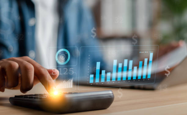 istock Data analysts work on business analytics dashboards with charts. Analysis of financial plans for long-term investments. 1494143084