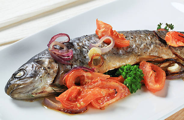 istock Baked trout with tomatoes and onion 149414356