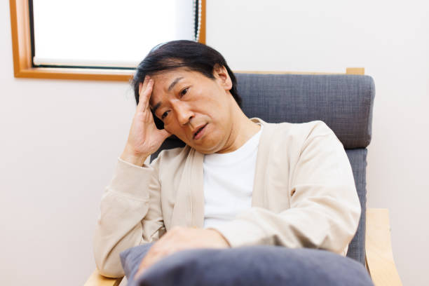 istock Mature Japanese man suffering from headache 1494145568