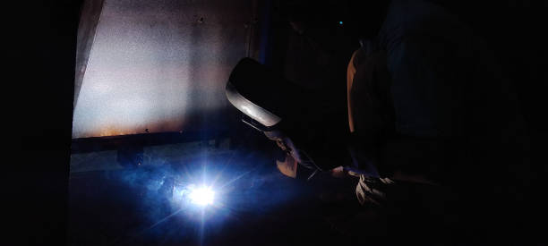 istock Portrait of Welder with welding beam 1494146461