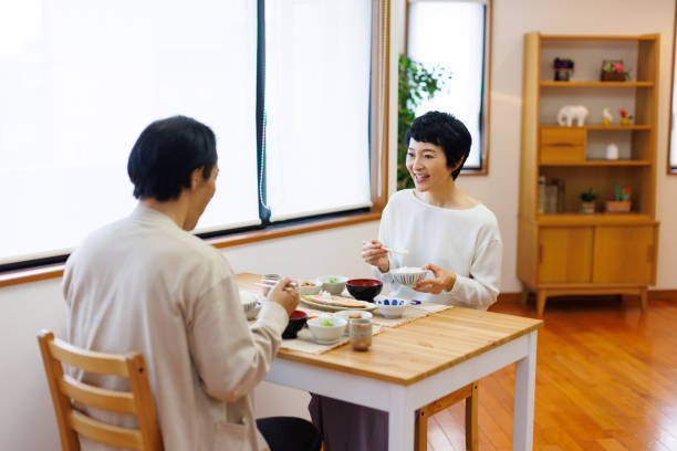 istock Mature Japanese couple eating their meal 1494150748