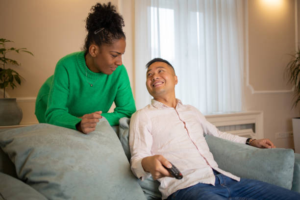 istock Young couple watching TV 1494153549