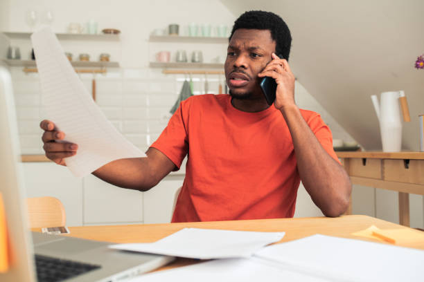 istock Young African-American freelancer working at his home office 1494153616