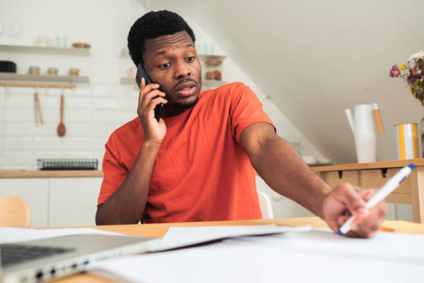 istock Young African-American designer working at his home office 1494153619