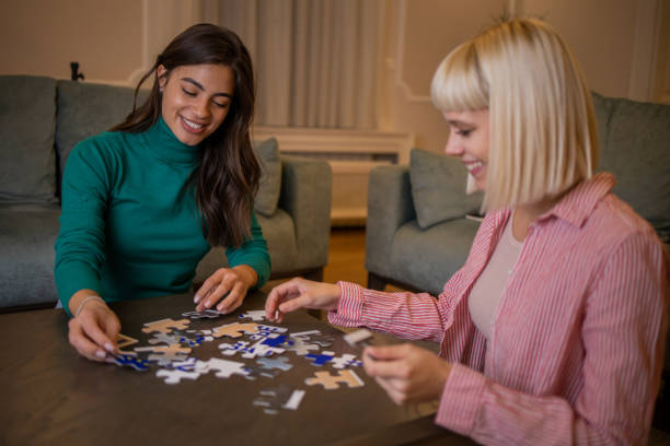 istock Friends doing a jigsaw puzzle at home 1494154205