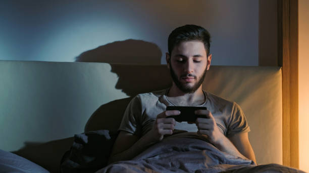 istock Phone movie digital insomnia man watching video 1494154780
