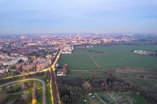 Cremona, Italy - January 2023 Sunset in plain near the city, Po bridge connecting Emilia Romagna and Lombardy