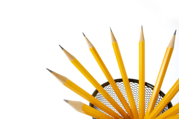 Pen holder full of pencils on isolated background