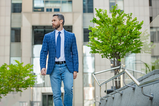 business manager walk on urban background. business manager wearing jacket in the street. photo of business manager with tie.business manager outdoor.