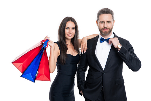 shopping couple in studio. shopping couple on background. photo of shopping couple with shop bags. shopping couple isolated on white.