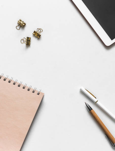 istock Education, finance background with free space - tablet, notepad, pen, stationery on a light background, top view 1494166552