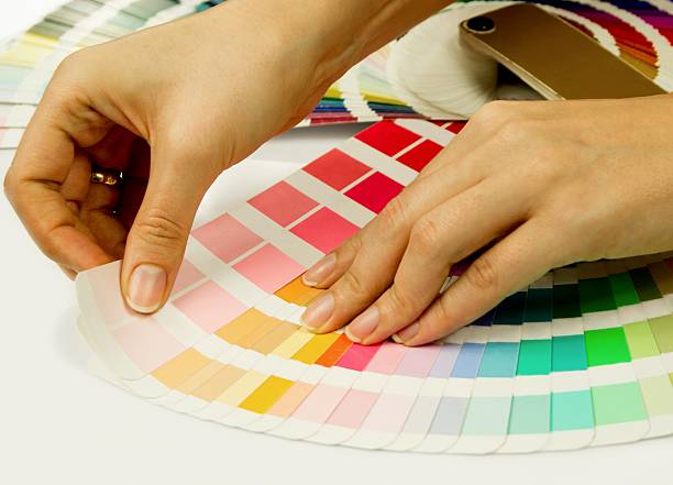 istock Woman selecting color from Pantone swatches book 149416666