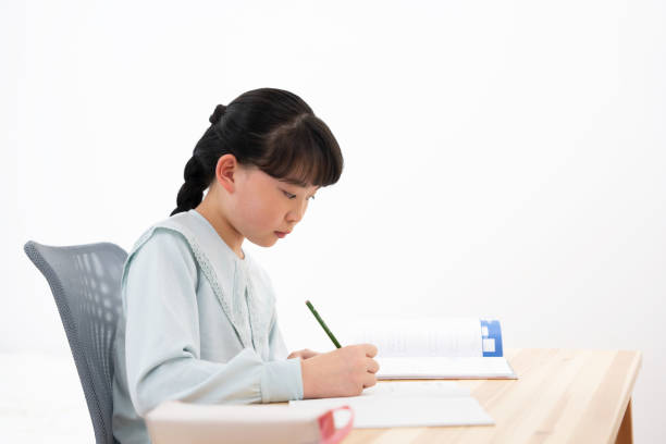 istock Japanese girl studying at home 1494168470