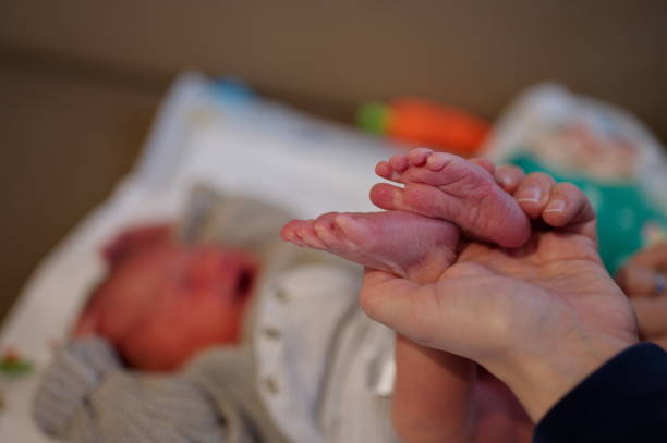 istock Newborn baby feet 1494169645