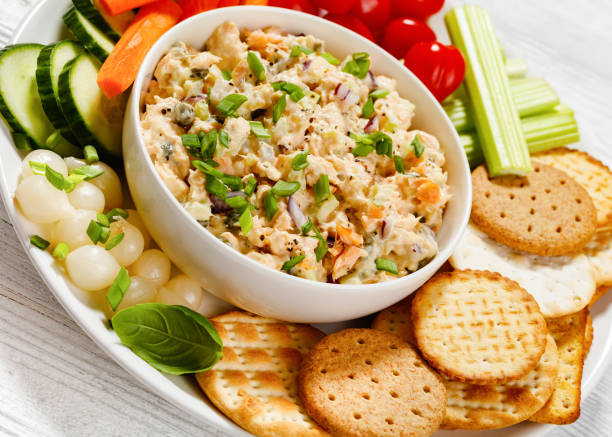 istock salmon salad with fresh veggies and crackers 1494171977