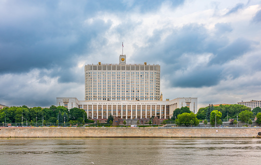 House of the government of the Russian Federation, White House, at summer sunset, Moscow, Russia. Night view. Translation of the inscription on the facade: House of the government of the Russian Federation