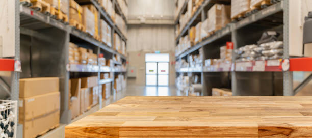 istock Wooden board empty table in front of blurred background. Perspective inside of warehouse with aisle pallet on high shelf can be used for display 1494182429