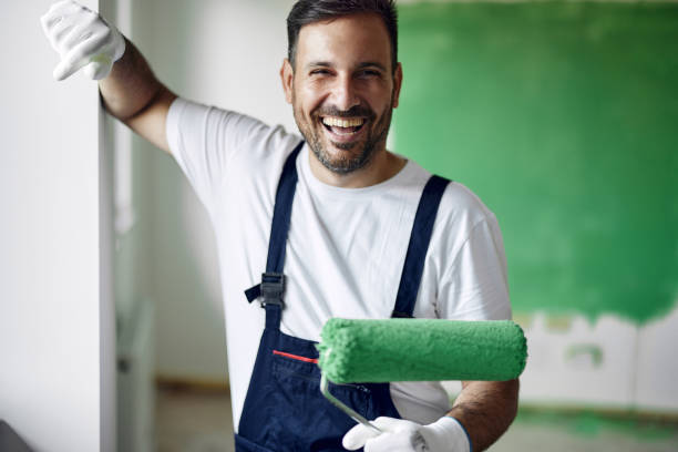 istock Happy house painter working on home renovation process. 1494188114