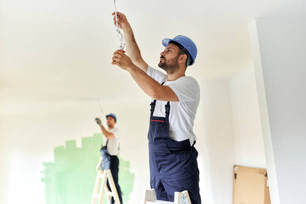istock Young electrician working on power cables in the apartment. 1494188587