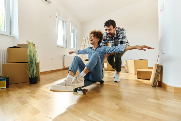 istock Cheerful couple having fun while unpacking at their new apartment. 1494189288