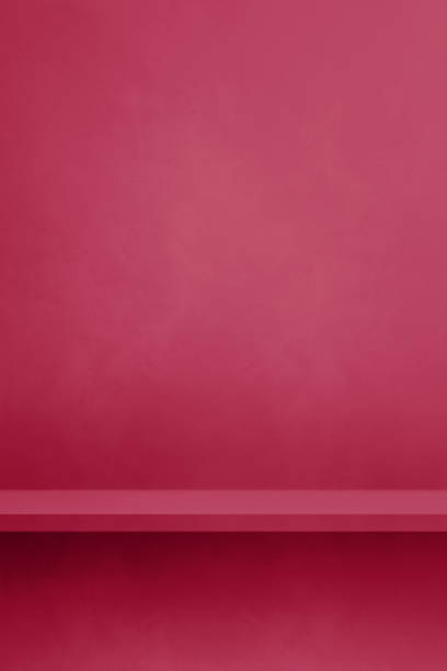 istock Empty shelf on a magenta pink concrete wall. Background template. Vertical mockup 1494195350