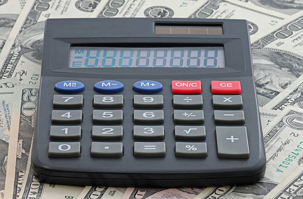 istock calculator on heap of money 149419541