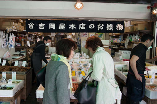 TOKYO, JAPAN - MARCH 27, 2015 : vendor and tourist at the morning in tsukiji fish market in tokyo.