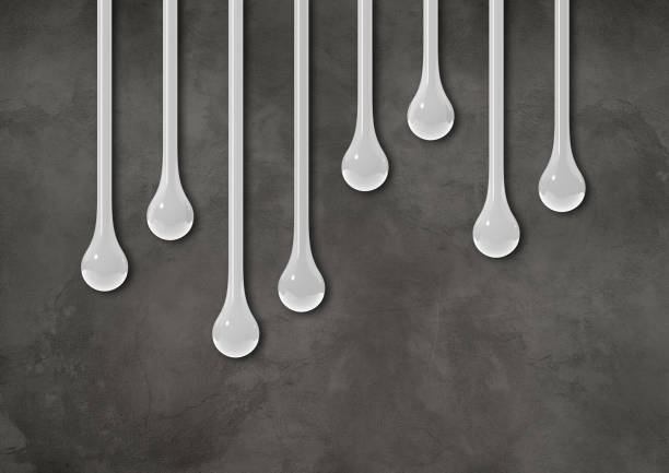 istock White ink drops on dark concrete wall. Horizontal wallpaper 1494195902