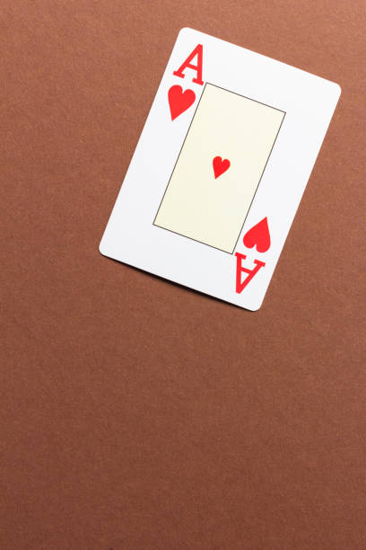 istock Ace of hearts card on brown background. 1494198966