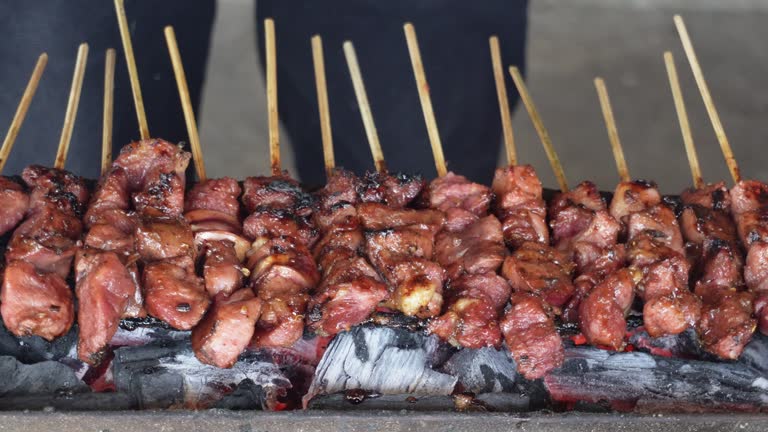 Goat satay on red fire grilling by people in Indonesia