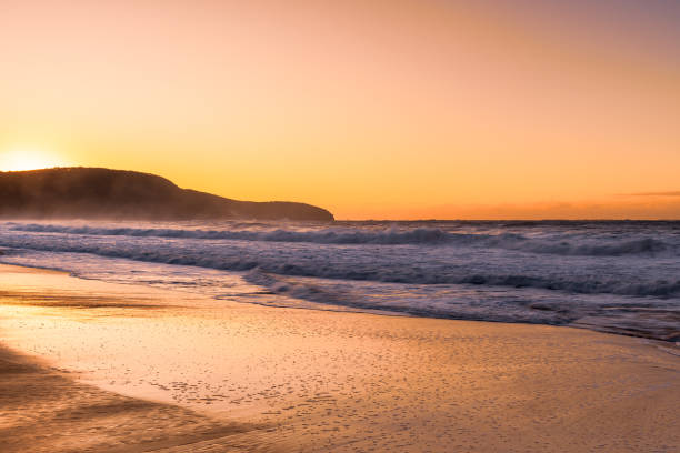 istock Sunrise and Waves - Surf's up at the seaside 1494201951