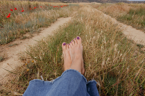 beautiful bare feet of a girl on the grass.