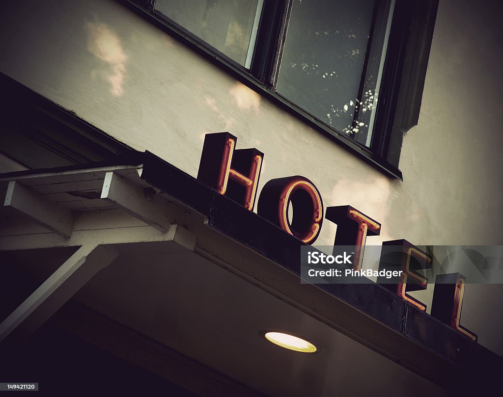 Vintage hotel sign Vintage red neon sign on small village hotel Architecture Stock Photo