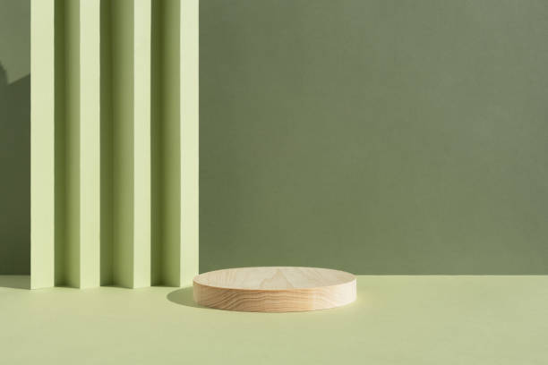 istock Geometric wooden podium on an abstract green background. A scene with a geometric background. Backdrop for the product presentation. Empty showcase, display case. 1494212708