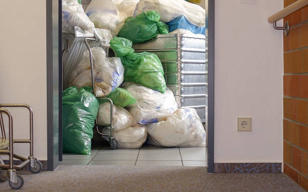 Medical waste in a nursing home. A large pile of plastic bags with diapers and other waste. The concept of safe waste management in hospitals and nursing homes. The concept of saving the environment. stock photo