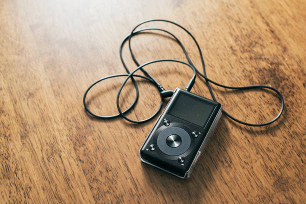 istock Music mp3 player on a wooden desk 1494215226