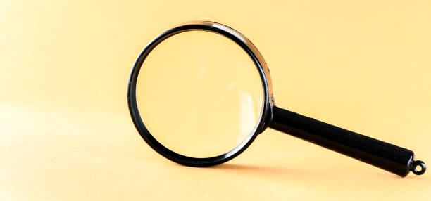 istock magnifying glass magnifier loupe search symbol on yellow background with copy space 1494217100