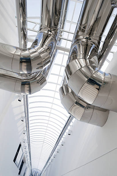 istock Shiny silver air conditioning ducts against a white wall 149421945