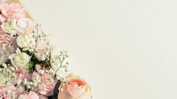 istock Flowers composition. Pink rose and carnation on white background. Flat lay, top view with copy space for text. 1494223220