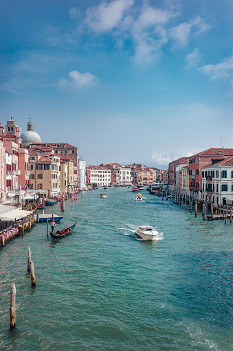 View of the Grand Canal, Venice, Italy, from Rialto Bridge. Buildings and boats.