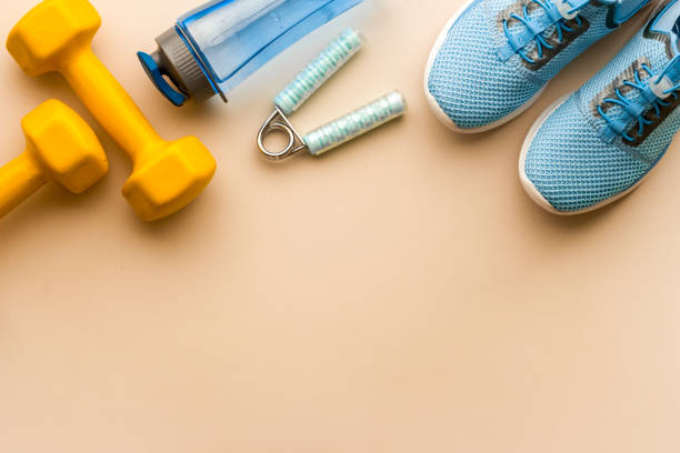 istock Sneakers and bottle shaker - workout flatlay, top view 1494236077