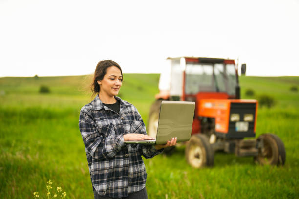 istock young female farmer controlling her field with laptop with smart farming apps 1494238152