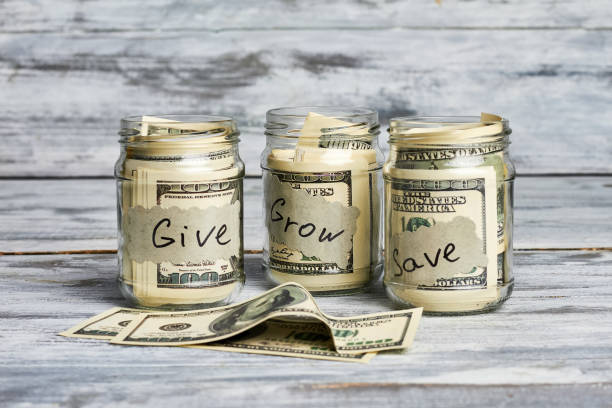 istock Glass jars with money. 1494238692