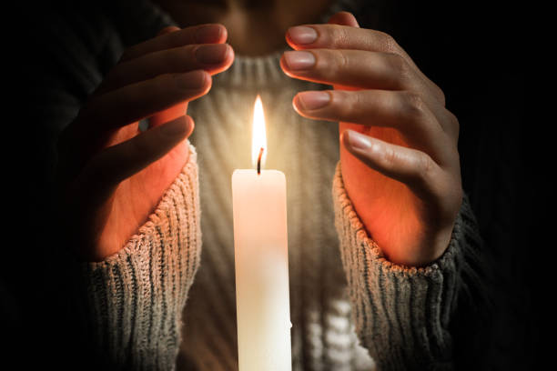 warm your hands over a burning candle