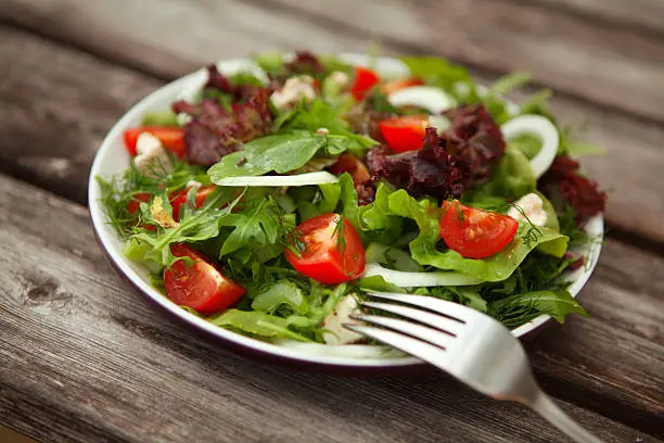 Photo of fresh salad with tomato and cucumber.green