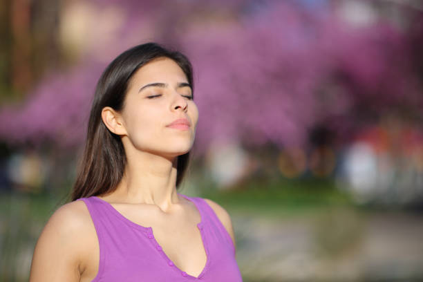 istock Woman on violet breathing fresh air 1494247405