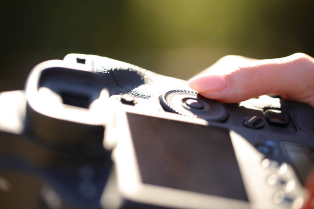 istock Photographer finger setting diaphragm aperture 1494247424