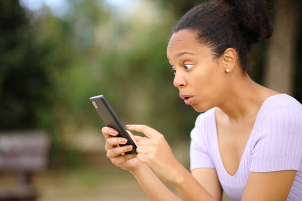 istock Amazed black woman checking phone 1494247494